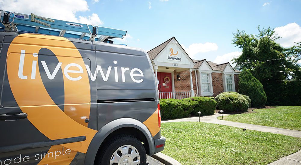 Livewire van parked in front of Livewire showroom on a sunny day