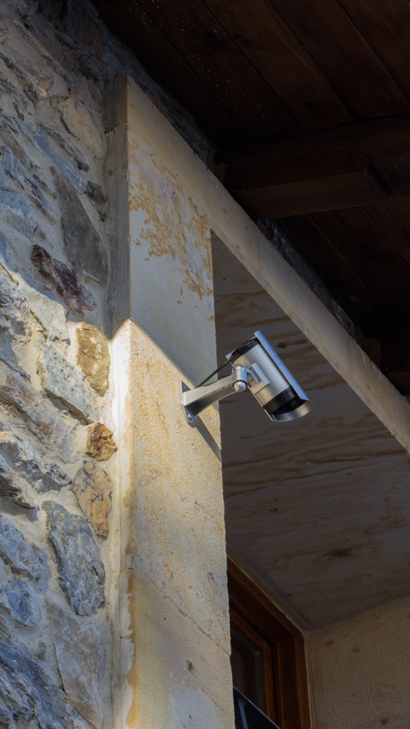 Outdoor security camera mounted on the top side of a business or commercial office