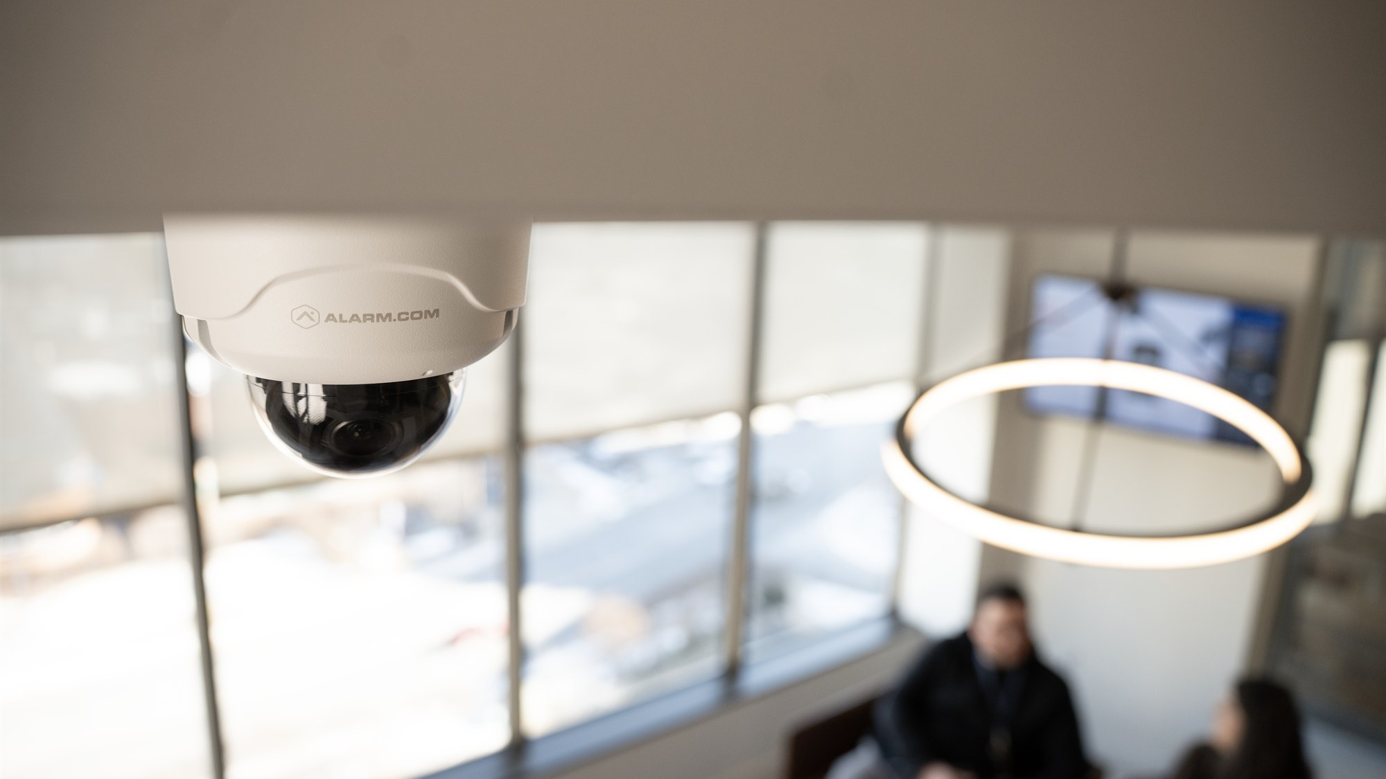 Alarm.com ceiling mounted security camera in a Central Virginia business